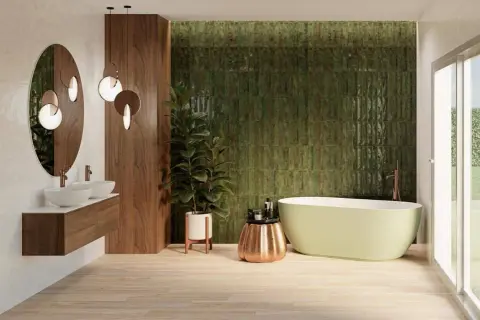 Salle de bain moderne avec mur texturé vert émeraude, parfait pour une inspiration salle de bain zellige. Bain autoportant, double vasque et bois chaleureux.