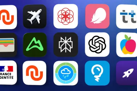 Grille d'icônes d'applications, incluant un avion, un portefeuille, un logo de montagne, et des symboles abstraits. Une mise à jour des applications est en cours.
