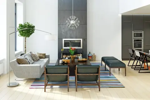 Nowoczesny salon z kominkiem i kuchnią. Styl wykończenia wnętrz to połączenie minimalizmu i elegancji.