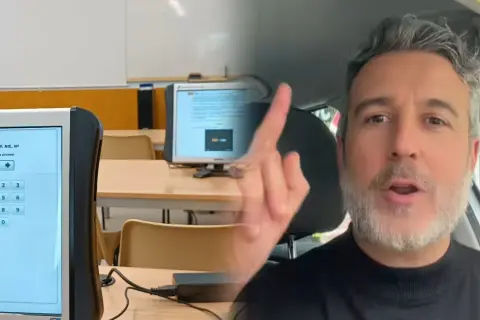 El profesor de la autoescuela sabe si has aprobado. Un hombre con barba gris habla a cámara, con un examen en pantalla al fondo.