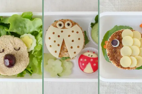 Kreative Pausenbrot Ideen für Kinder: Ein Bär, Marienkäfer und Fisch aus Sandwiches und Gemüse.