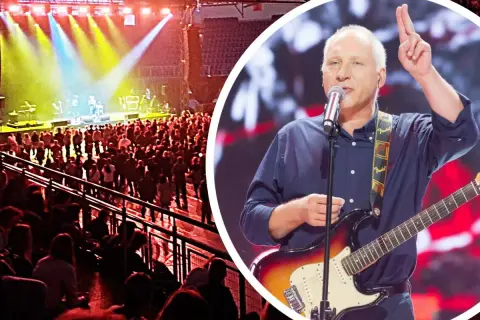 Wokalista z gitarą elektryczną na scenie, tłum widzów na elektryczne gitary koncertach.