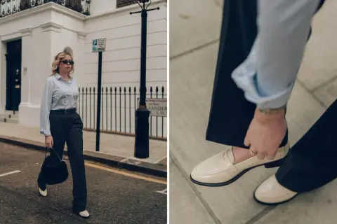 Scarpe per tailleur pantalone: mocassini chiari completano un look elegante con pantaloni scuri e camicia a righe.