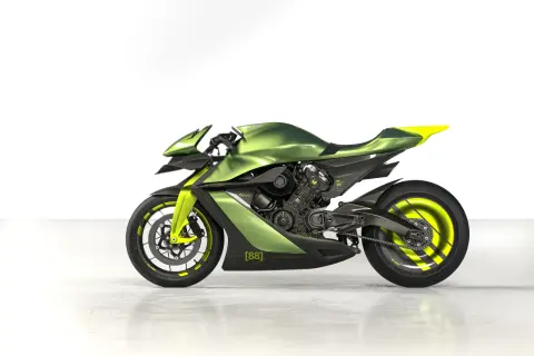 La Aston Martin AMB 001, una moto deportiva futurista en verde metálico y detalles neón, lista para la velocidad.