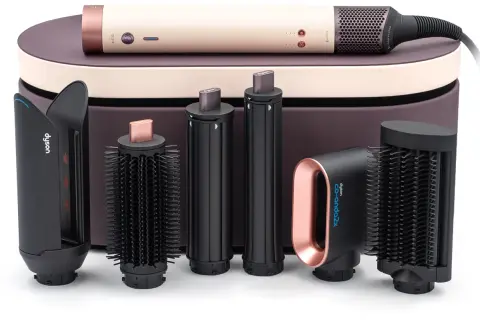 Zestaw Dyson Airwrap z różnymi końcówkami i etui.