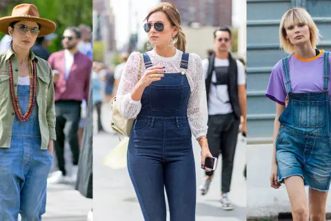 Tre donne indossano salopette di jeans. Una con camicia verde e cappello, una con blusa di pizzo, l'altra con t-shirt viola. Ecco cosa mettere sotto la salopette!