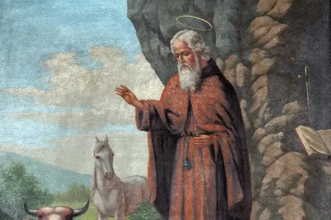 Św. Antoni z Padwy, otoczony aurą, błogosławi zwierzęta. Obok niego koń i krowa, symbolizujące cuda św. Antoniego.