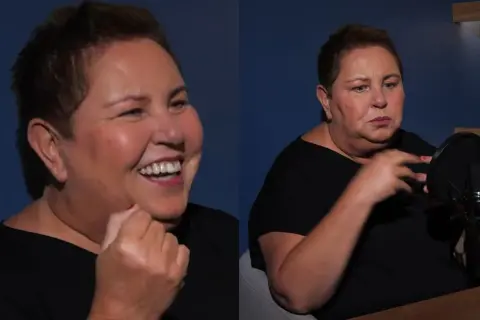 Dorota Wellman waga: uśmiechnięta i skupiona podczas rozmowy przy mikrofonie.