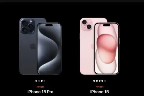 Dwa nowe modele iPhone 15: Pro w kolorze grafitowym z potrójnym aparatem i zwykły iPhone 15 w kolorze różowym.