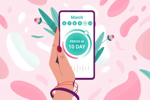 Dłoń trzyma smartfon z aplikacją flo, która pokazuje "PERIOD IN 10 DAY" i daty marca.