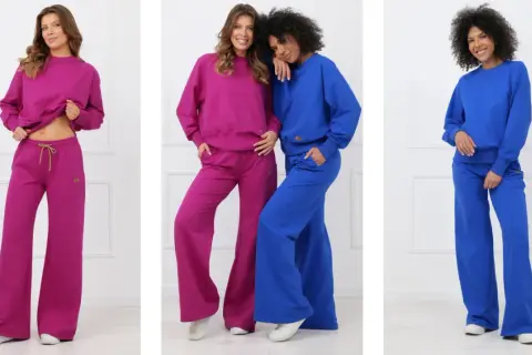 Trzy kobiety prezentują zestawy dresowe w kolorach fuksji i kobaltu. To kwintesencja sportowej elegancji, idealnej na co dzień.
