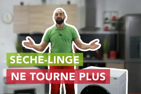 Un homme explique pourquoi son sèche-linge ne tourne plus, devant un appareil et une cuisine floue.