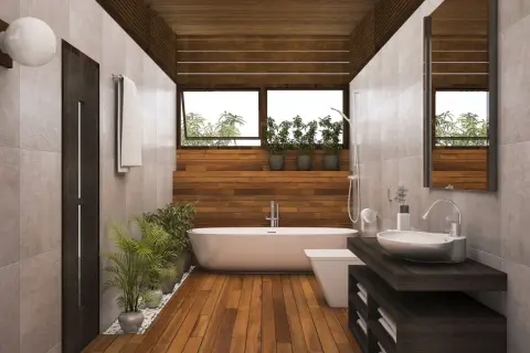 Salle de bain moderne avec baignoire, lavabo et toilettes. Le sol en parquet contraste avec le carrelage mural.