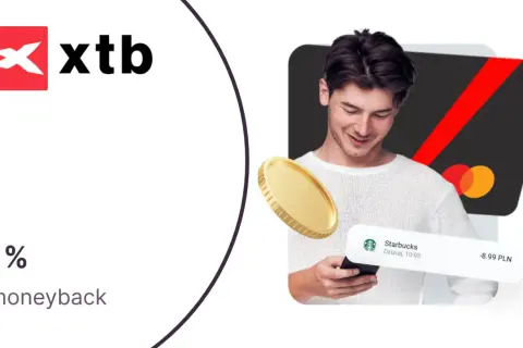 XTB cashback 1% na zakupy. Wypłata środków ile trwa? Złota moneta i karta płatnicza.