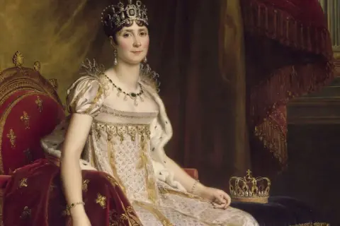 Portrait de Joséphine Bonaparte, impératrice, parée de bijoux, assise sur un trône, rappelant son union avec Napoléon.