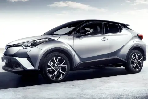 Silver Toyota C-HR hybrid, elegant design, ready for any journey. A stylish car, but some owners report a minor toyota chr problem with the infotainment system.