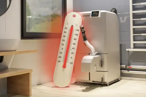 Duży termometr wskazuje za wysoką temperaturę na piecu gazowym.