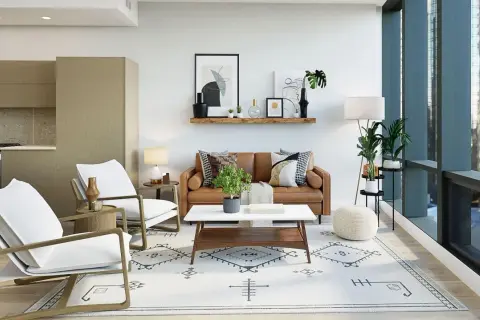 A modern traditional interior design featuring a brown leather sofa, white armchairs, and a geometric rug.