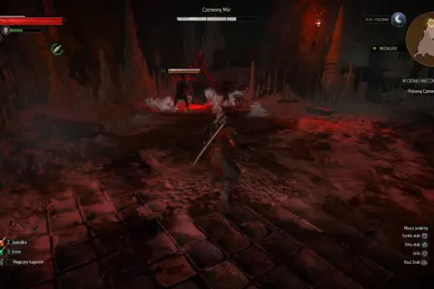 Wiedźmin 3 w cieniu wiecznego ognia. Geralt walczy z Ofiarą zarazy w jaskini, otoczony czerwonym światłem i stalaktytami.