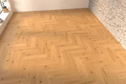 Suelo de madera con disposición en espiga, creando un patrón clásico y elegante.