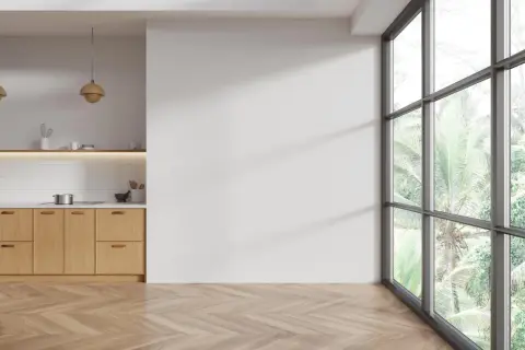 Cocina moderna con suelo de madera en espiga. Aprende como limpiar suelo de madera para mantenerlo impecable.