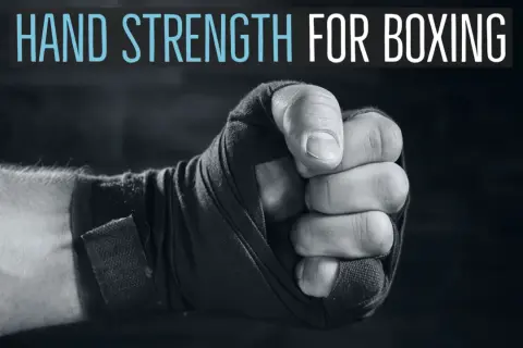 Close-up of a boxer's fist wrapped in tape, with text "HAND STRENGTH FOR BOXING" above. Learn how to strengthen wrists for boxing.