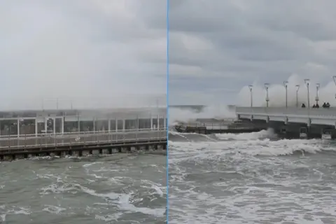 Sztorm na Bałtyku szaleje. Potężne fale rozbijają się o molo i budynek przy plaży.