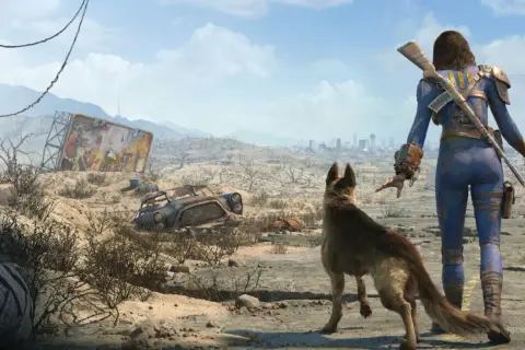 Eine Frau im blauen Schutzanzug und ihr Hund blicken auf eine zerstörte Stadt. Ein Testbild für Fallout 4.