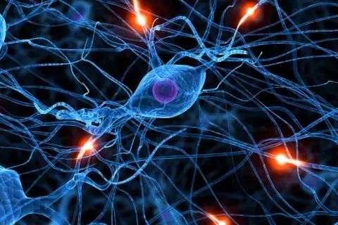 Neurones bleus interconnectés, avec des éclairs d'énergie orange. Une image qui évoque la complexité du cerveau, et la recherche sur la parkinson cause psychologique.
