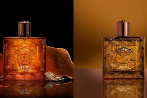 Złota butelka Versace Eros Parfum, otoczona kamieniami i szafranem, emanuje luksusem.
