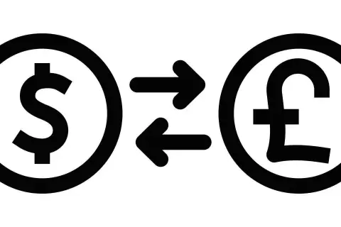 Symbol dolara i funta połączone strzałkami, ilustrujące wymianę walut, czyli co to są dewizy.
