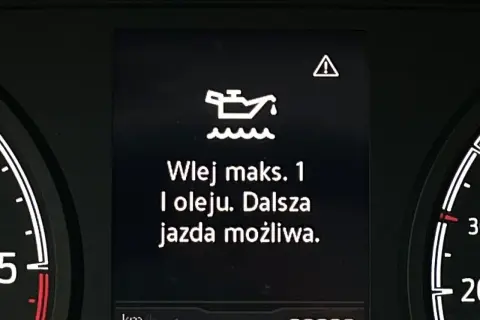 Kontrolka oleju z falą: "Wlej maks. 1 l oleju. Dalsza jazda możliwa." ostrzega o niskim poziomie oleju.