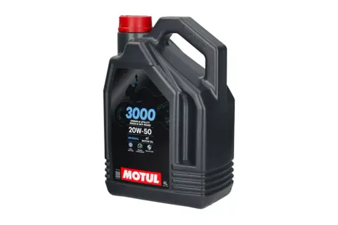 Czarny kanister z czerwonym korkiem, zawierający olej silnikowy Motul 3000 20W-50.