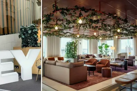 Stora vita bokstäver "EY" och en modern lounge med växter i taket, perfekt för att jobba hybrid.