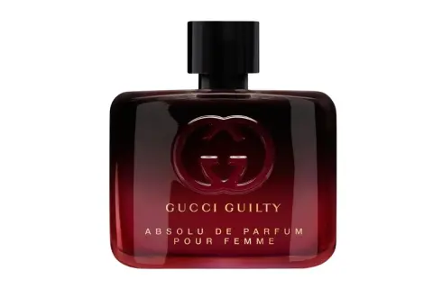 Elegancka butelka perfum Gucci Guilty Absolu de Parfum Pour Femme w odcieniach czerwieni i czerni.