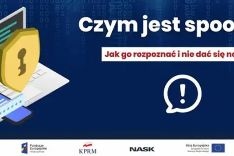 Czym jest spoofing? Grafika przedstawia laptop, telefon i tarczę z kluczem, symbolizujące bezpieczeństwo. Dowiedz się, jak rozpoznać spoofing i nie dać się nabrać.