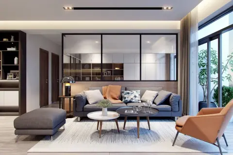 Soggiorno moderno con divano grigio, poltrona color terra e tavolini. Idee originali per arredare casa con stile e comfort.