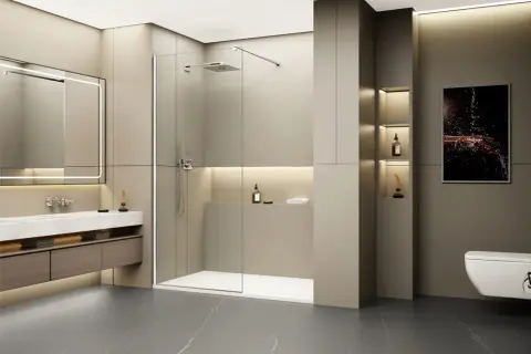 Salle de bain moderne avec un grand miroir lumineux, un lavabo suspendu et une spacieuse cabine de ressaut douche en verre.