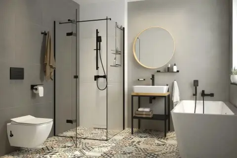 Nowoczesna łazienka z wanną, prysznicem i umywalką. Zastanawiasz się, bidet co to? To urządzenie do higieny intymnej, które może być osobnym elementem lub funkcją toalety.