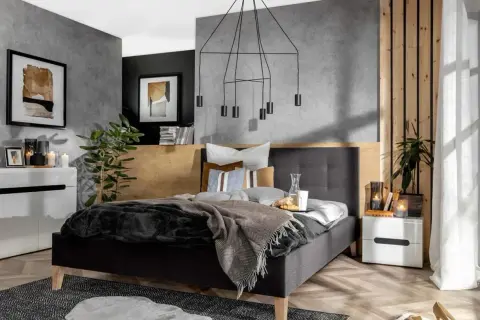Nowoczesna, szara sypialnia inspiracje. Betonowa ściana, drewniane akcenty i minimalistyczne meble tworzą przytulną atmosferę.