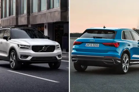 Jämförelse av en vit Volvo XC40 och en blå Audi Q3. En audi q3 test visar dessa två SUV:ar sida vid sida.