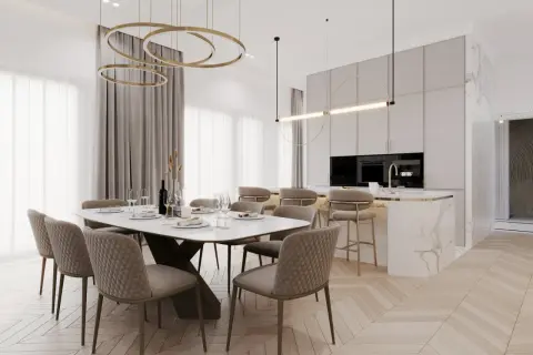 Elegancka jadalnia i kuchnia w stylu modern classic z marmurową wyspą i złotymi akcentami.