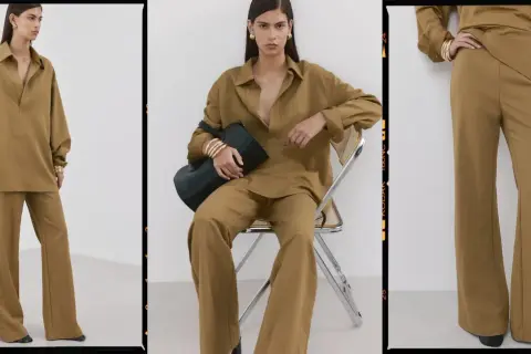 Modello indossa un completo color kaki, una tonalità calda e terrosa che ricorda la terra. La camicia oversize e i pantaloni a zampa creano un look elegante e rilassato.
