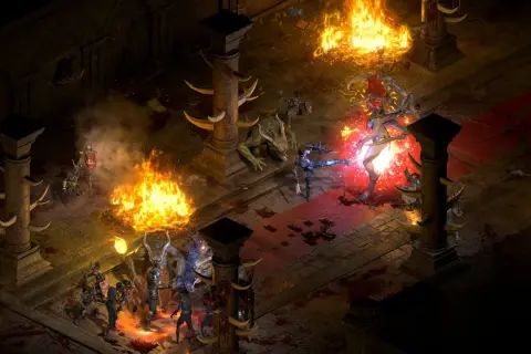 Wojownicy walczą z potworami w płomieniach i mroku, to scena z diablo 2 resurrected patch.