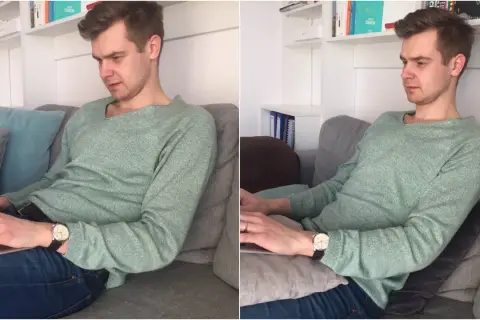 Mężczyzna w swetrze siedzi w **pozycji półleżącej** na kanapie, pracując na laptopie.