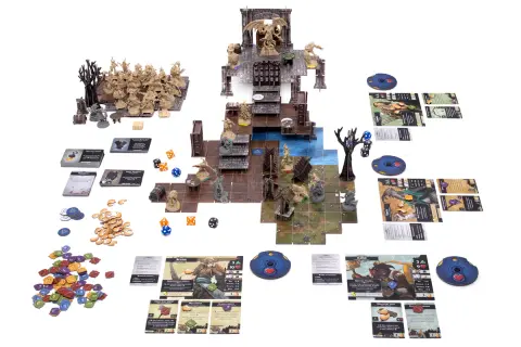 Figurki i plansza do gry planszowej "Descent: Legendy Mroku". Bohaterowie walczą z potworami w mrocznych lochach.