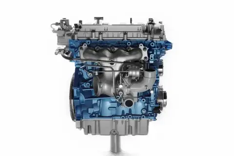 Silnik 1.9 TDI z niebieskim blokiem i turbosprężarką.