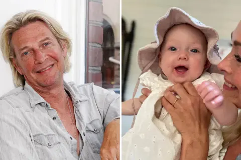 Tommy Nilsson ler mot kameran, bredvid en kvinna som håller ett leende barnbarnsbarn i en söt hatt.