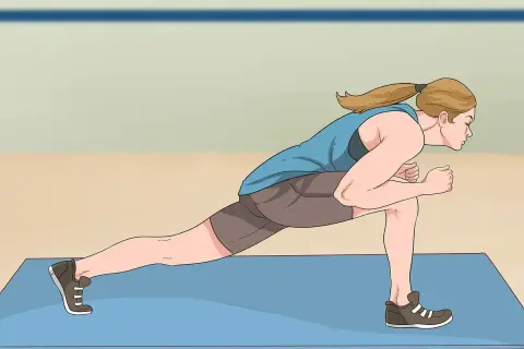 Woman performing a dynamic jumping lunges exercise on a blue mat, demonstrating proper form for an explosive workout.