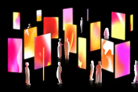 Silhouetted figures explore a gallery of vibrant, glowing digital art, showcasing contemporary art trends with abstract gradients and light.